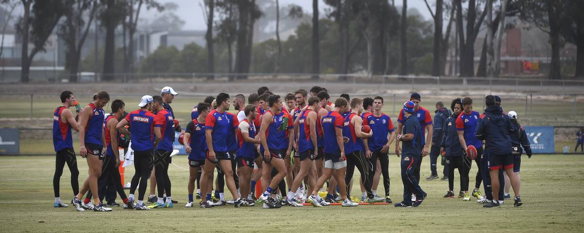 SETTLING IN: Western Bulldogs' playing group hits Wendouree Oval for training in trademark Ballarat football conditions. Picture: Luka Kauzlaric
