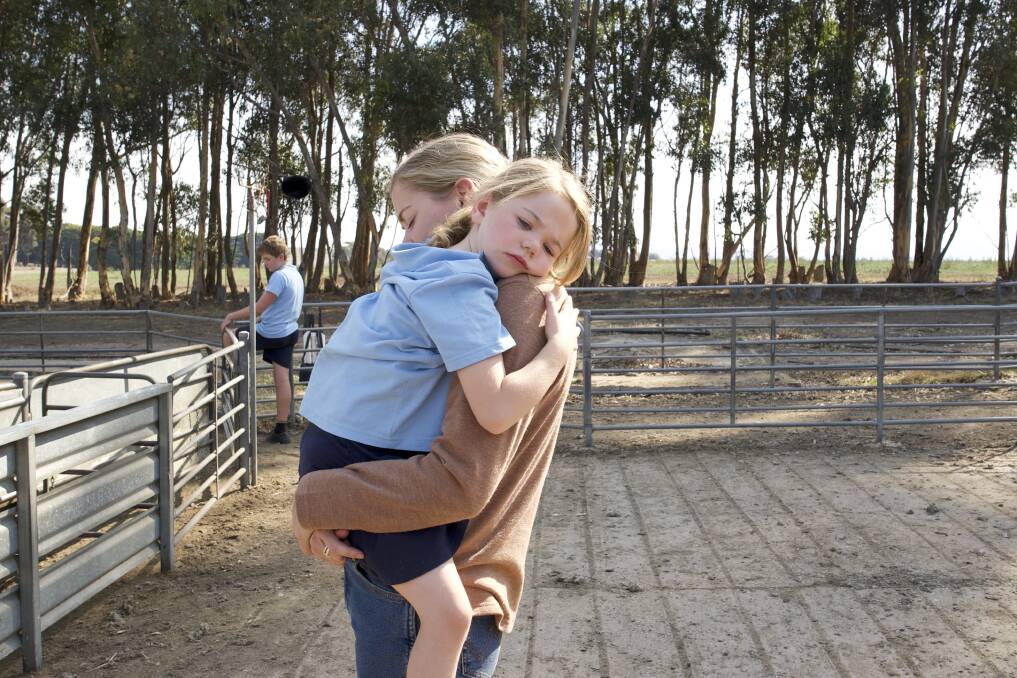 Leila McDougall with her daughter Vivian in a scene for Just a Farmer, has written a story she hopes will provide 'light in the shade' and hope. Picture Just a Farmer