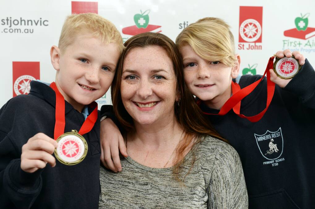 GUARDIAN ANGELS: Connor, eight, and Sam Algie, 10, with mum Sarah. Picture: Kate Healy