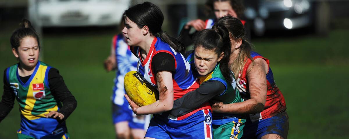 FUTURE: East Point's Kiera Toman tackled and under pressure in Ballarat Football League's new under-12 girls full-contact competition. Picture: Lachlan Bence