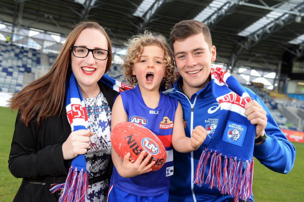 HYPE: City of Ballarat councillor Amy Johnson, five-year-old Charlie, and Western Bulldogs premiership player Josh Dunkley have already started cheering for the first AFL premiership season game in Ballarat. Picture: Kate Healy