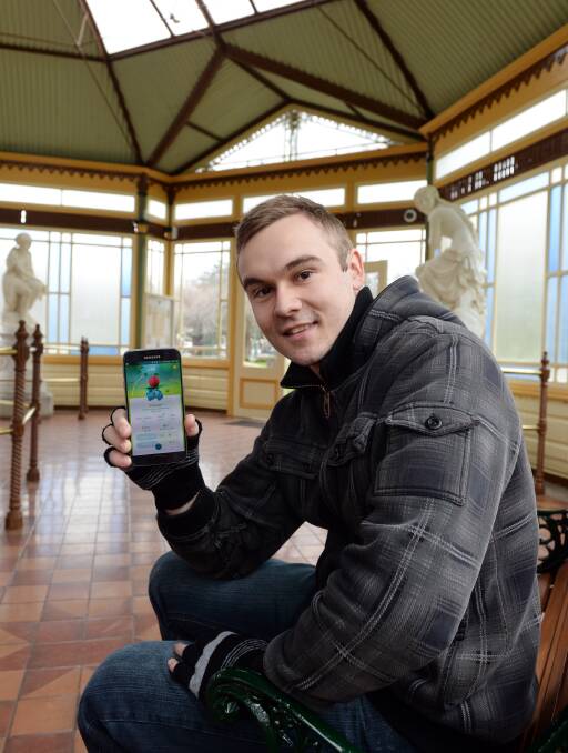 CAPTURE: Ballarat Pokémon GO trainer Sam Huther finds anime creatures in one of the city's most picturesque pavilions. Picture: Kate Healy