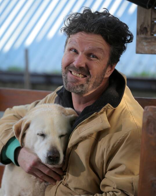Finding new pathways: Warrnambool's Glenn "Gator" Heazlewood with his dog Chloe. Mr Heazlewood was involved in a car accident when he was 18, leaving him with an aquired brain injury. Picture: Rob Gunstone