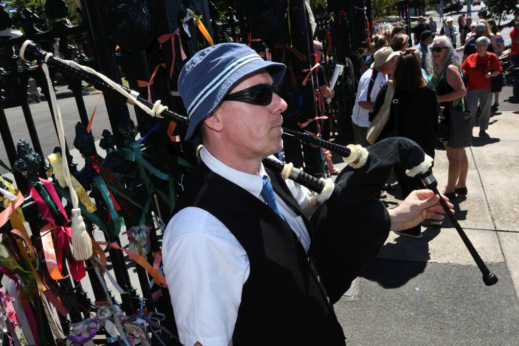 Pipes: Chris Thorburn brought bagpipes to show solidarity with survivors in Scotland.