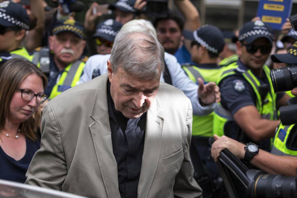 Cardinal George Pell leaves court in Melbourne on Tuesday. Picture: AAP/Daniel Pockett