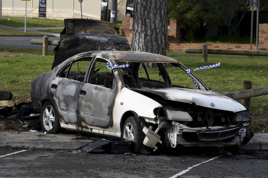 The burnt-out car in Mount Pleasant on Saturday morning. Picture: Lachlan Bence