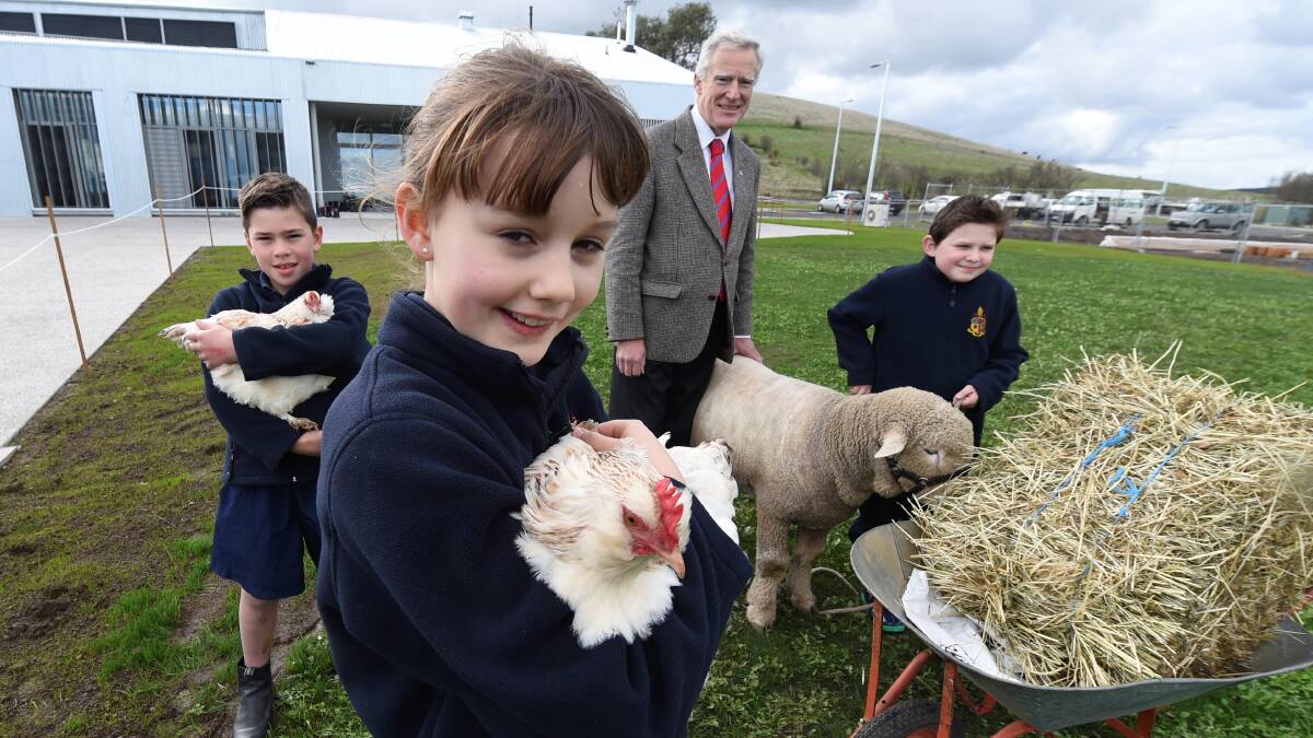 Ballarat Grammar headmaster Stephen Higgs, Jack Quinlan, Charlotte Dolan, and Oliver Lembo, get to know some of the residents at the schools new campus in 2014. Picture: Lachlan Bence