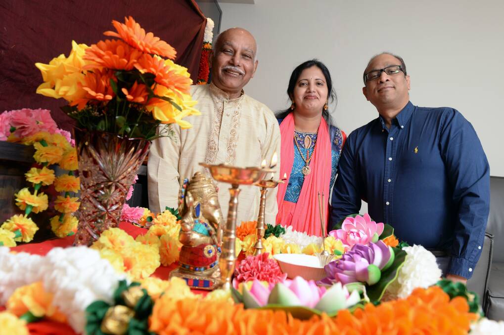 Celebration: Khushi Maharaj, Dr Vani Peddi and Dr Praveen Chandra in preparation for the celebration Ganesh Chaturthi. Picture: Kate Healy
