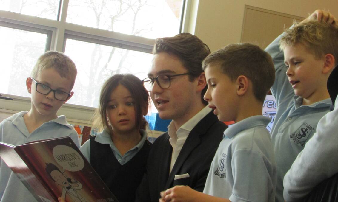 Voice singing star Harrison Craig visited students at St James' Parish School today for Book Week, launching his own picture book. Pictures: provided. 