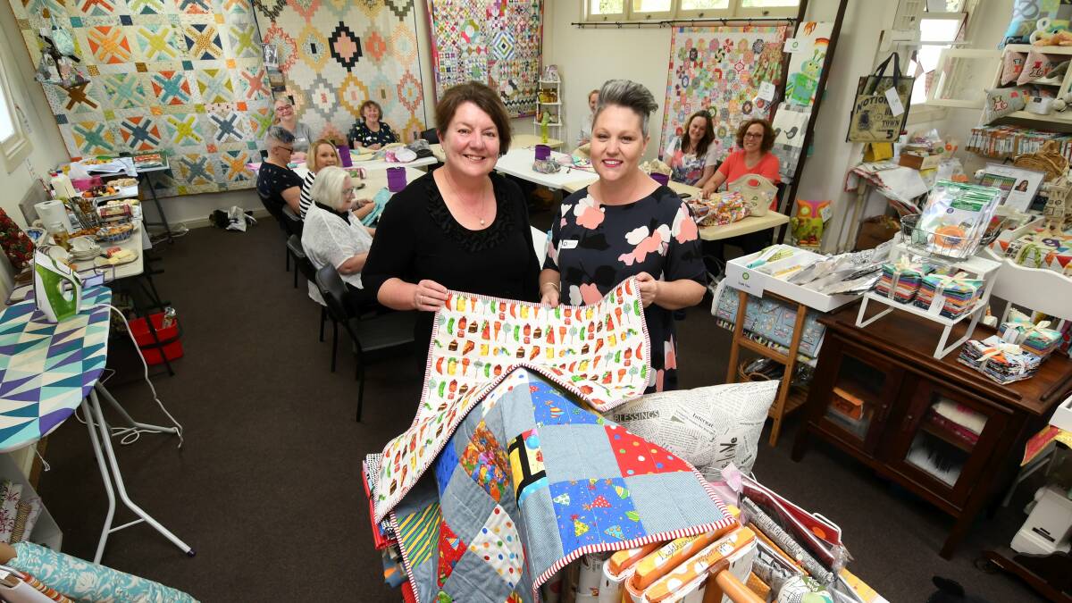 Warm: Cotton Factory owner Alison Von Bibra and Very Snuggly Quilt Program's Josephine Kelly. Picture: Lachlan Bence