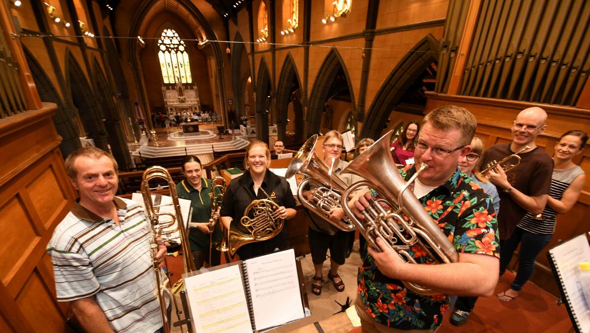 Trumpets: The Creswick Brass Band tune up at Saint Patricks Cathedral during a rehearsal for the annual Carols in the Cathedral event, which will take place on Friday night. Picture: Lachlan Bence