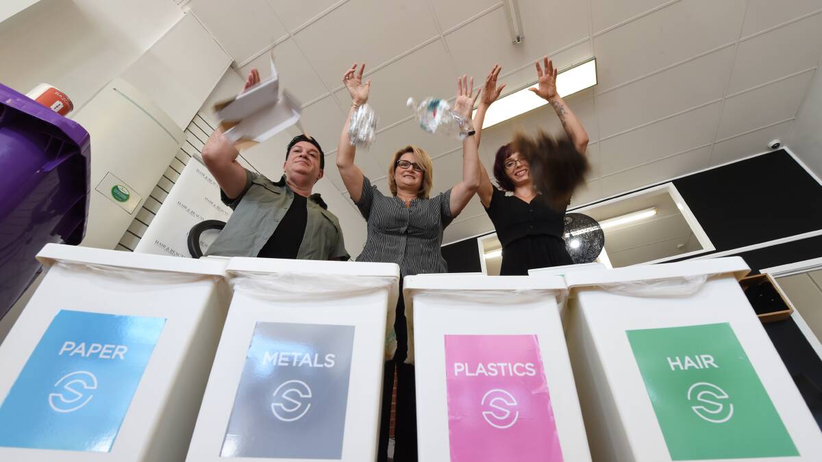 A cut above: Hair & Beauty on Dana staff member Dominic Marafioti, owner Debbie Mercer and staff member Belinda Hedji with their separate recycling bins. Picture: Jeremy Bannister