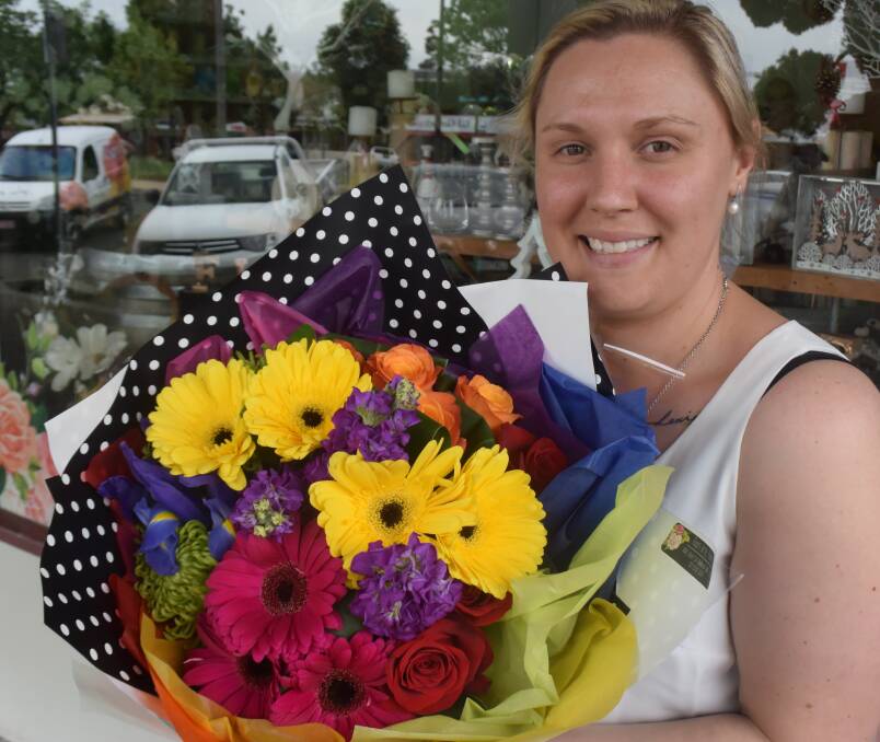 Bright: Fiori Arte Florist owner Anna Harmes holds a rainbow bouquet in honor of the 'Yes' vote in the same-sex marriage postal survey. She hopes she will be able to create bouquets for same-sex weddings soon. 