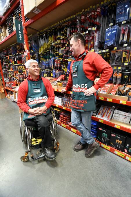 On the job: Double amputee Owen Telford and Bunnings manager in Ballarat Justin Catley. Picture: Lachlan Bence