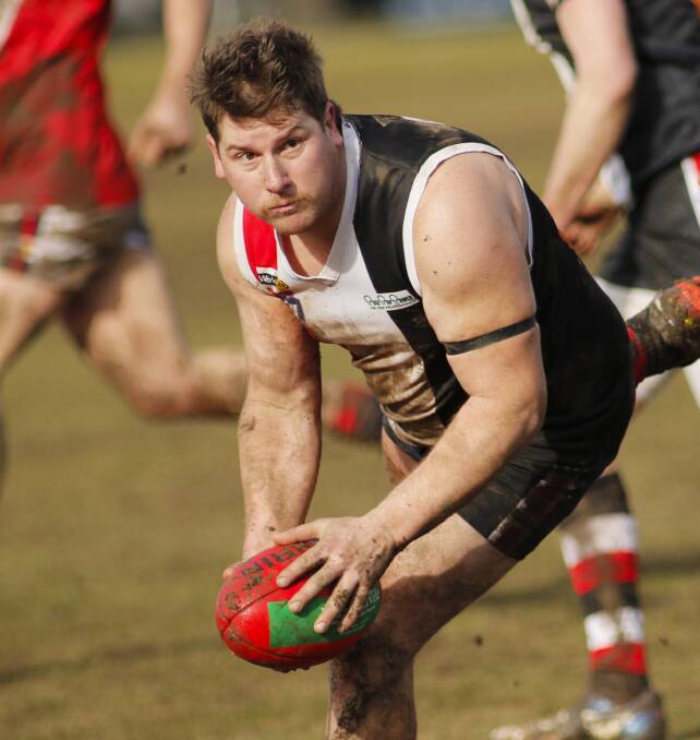 DETERMINED: Creswick's David Wrightlooks to pass the ball during the second quarter of the round 16 match against Skipton. Picture: Dylan Burns