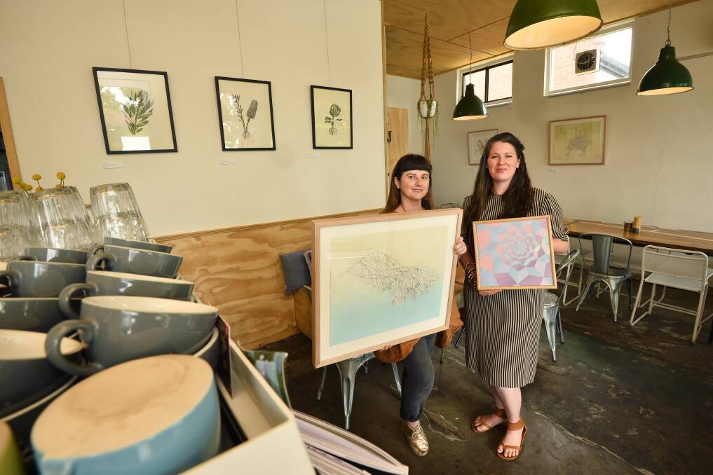 GIVING A GO: The Local owner Tracey Simmonds, left, and artist/photographer Ebony Gulliver, at the Lydiard Street North cafe. Picture: Dylan Burns