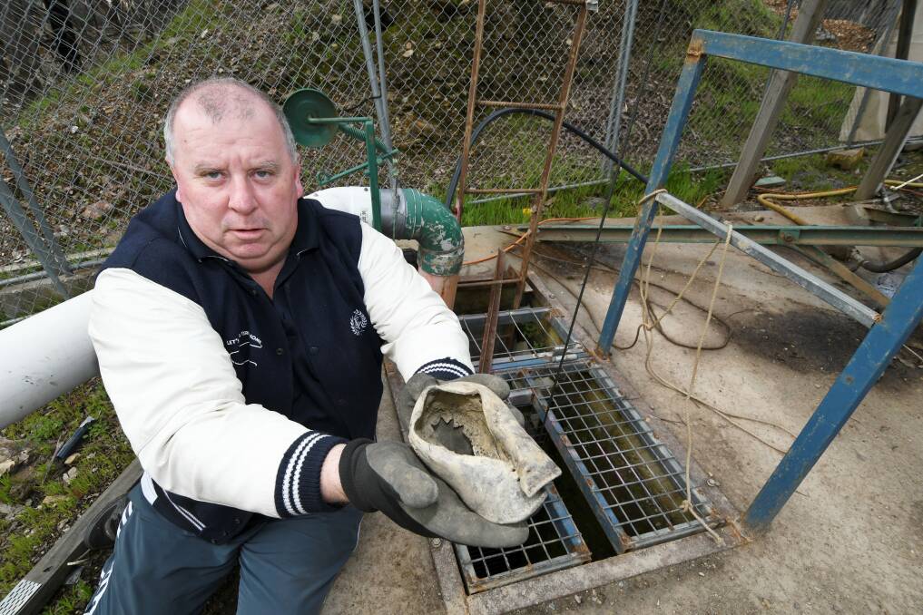 NEW HOPES: Daryl Floyd at the Morning Star Mine at Avoca with the child's shoe discovered underneath tonnes of gravel. Picture: Lachlan Bence