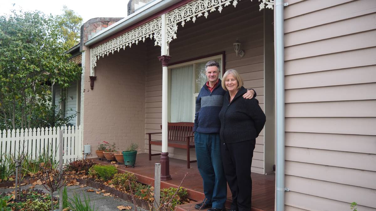Saving the planet in style: Evan and Maggie McDowell in front of their inner city Ballarat home. The old weatherboard home has been converted into an eco-friendly oasis. Picture: Bethan Wainman