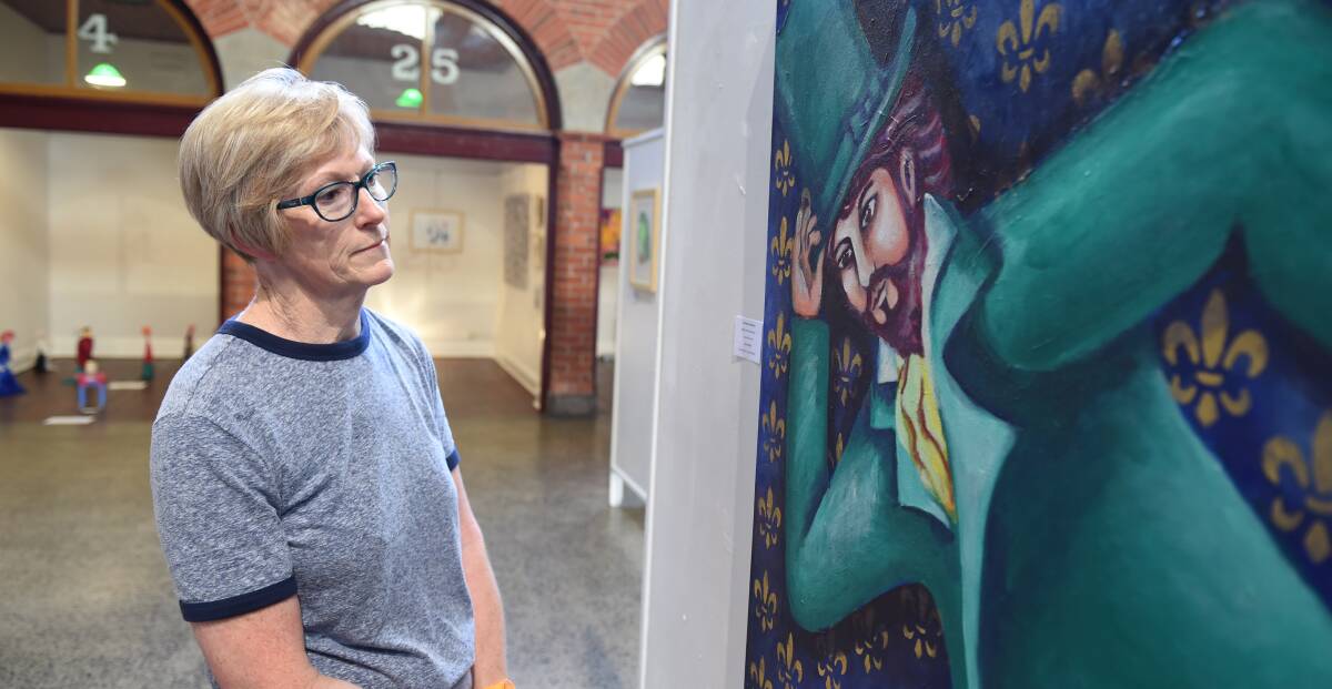 Taking a look: Helen Watson admires some of the work at the SNAP Arts and Disability Festival, which ran over 10 days .  Picture: Lachlan Bence. 