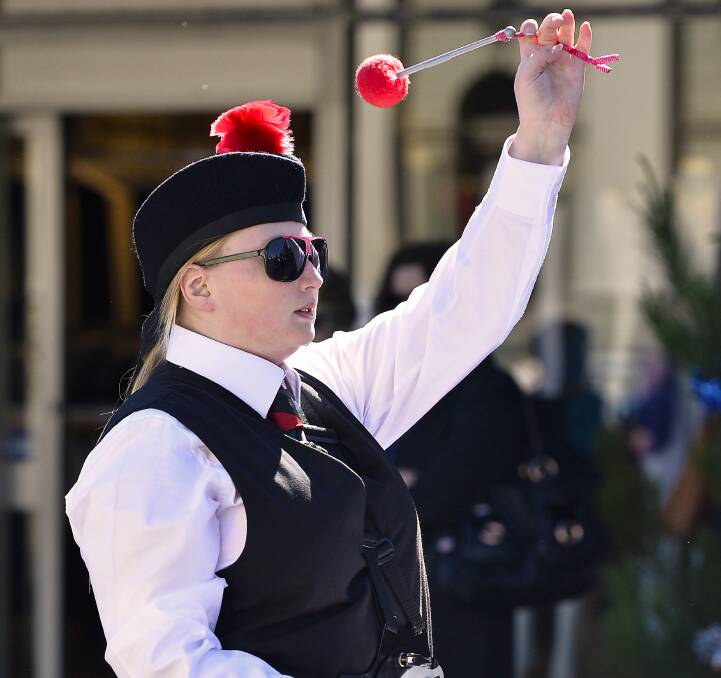 Keeping the beat: Frankston RSL drummer Shoshanna Lyons keeps in time while marching down Vincent Street on Saturday morning as part of the Daylesford Highland Gathering.  Picture: Dylan Burns. 