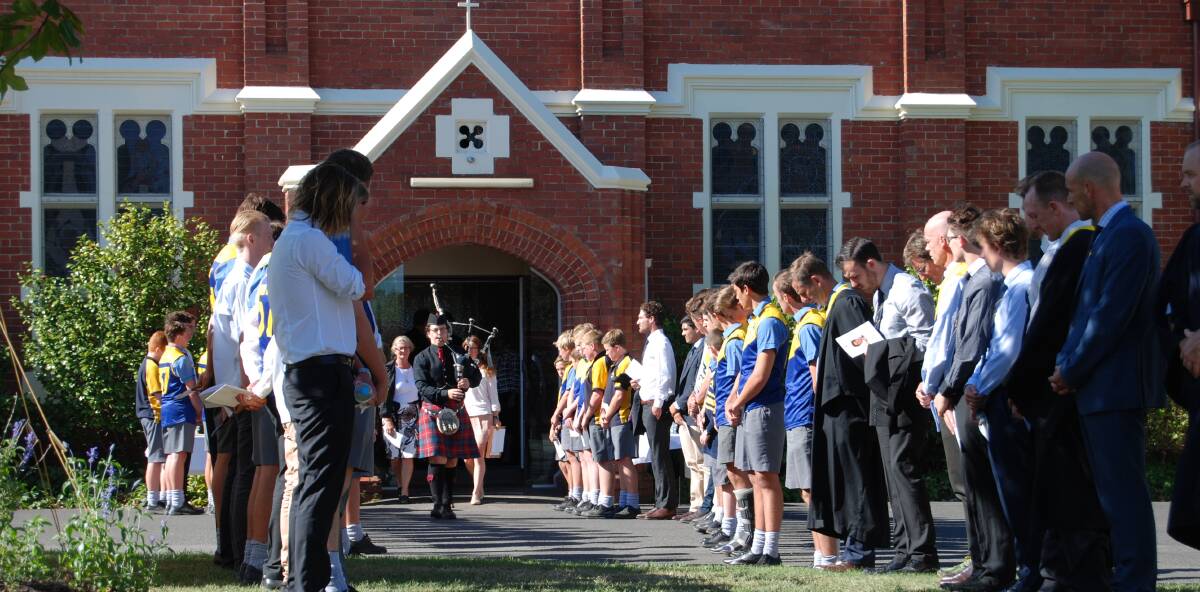 Memorial: Members of Ballarat Grammar's Wigan House form a guard of honour to remember Ford Guthrie.  Picture: Supplied.