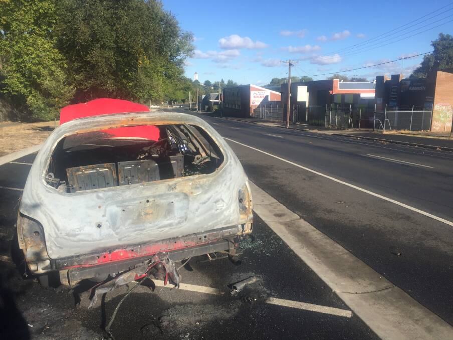The burnt out vehicle on Scott Parade 