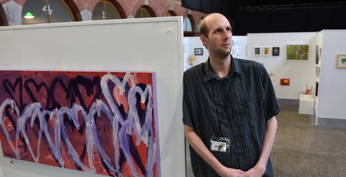 Appreciating the art: Donald Harley takes in the work at the SNAP Arts and Disability Festival at the Mining Exchange on the weekend.  Picture: Lachlan Bence. 