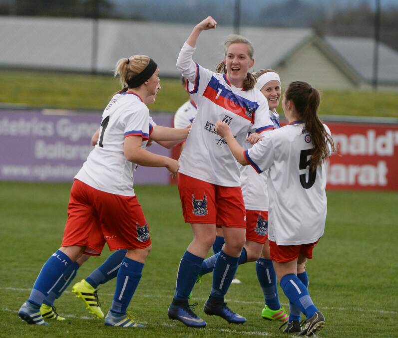Celebration: Vic Park White's Kirsten Rush celebrates a goal with her teammates. The Vultures will now progress to the second week of the BDSA finals series.  Picture: Kate Healy. 