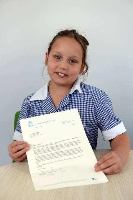 PROUD: Rebecca Harrison holds up the letter she received from Victorian Premier Daniel Andrews in response to her request for more health funding. Picture: Kate Healy 