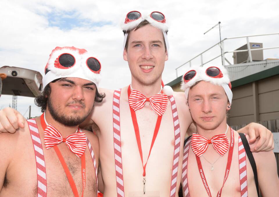 Enjoying the festivities: Toby Bell, Tez Kavanagh-Dando and Corey Ray from Daylesford look the part for the Sexy Santa Pub Crawl on Sunday. 