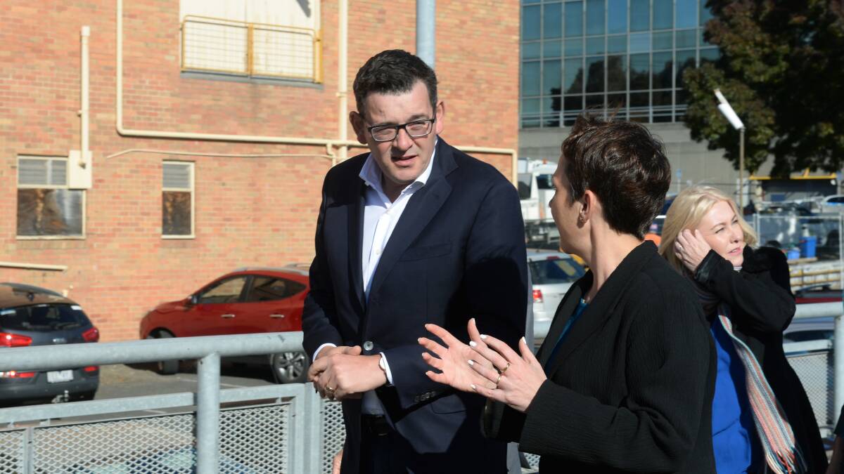 Premier Daniel Andrews inspects the Civic Hall site earlier this year. 