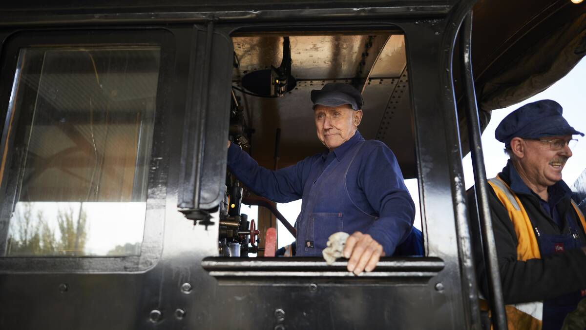 Stalwart: Train driver Allan Nicholas manning the steam train on Saturday.  Picture: Luka Kauzlaric.