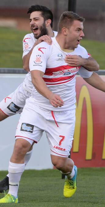 North Geelong's Juso Julardzija and Nicholas Jurcic celebrate a goal. 