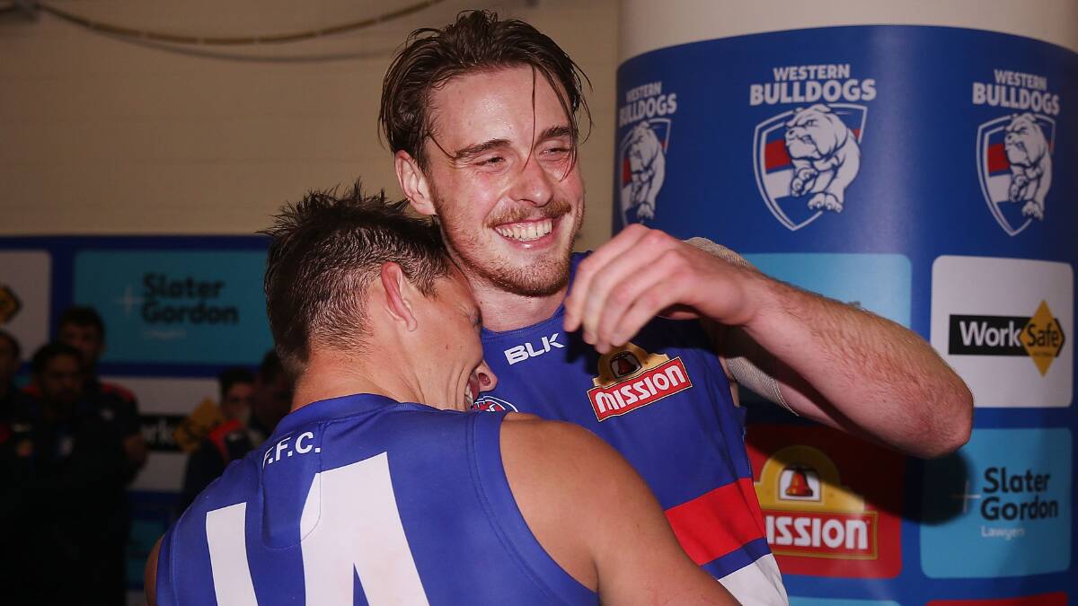 Clay Smithhugs Jordan Roughead.  Picture: Getty Images. 