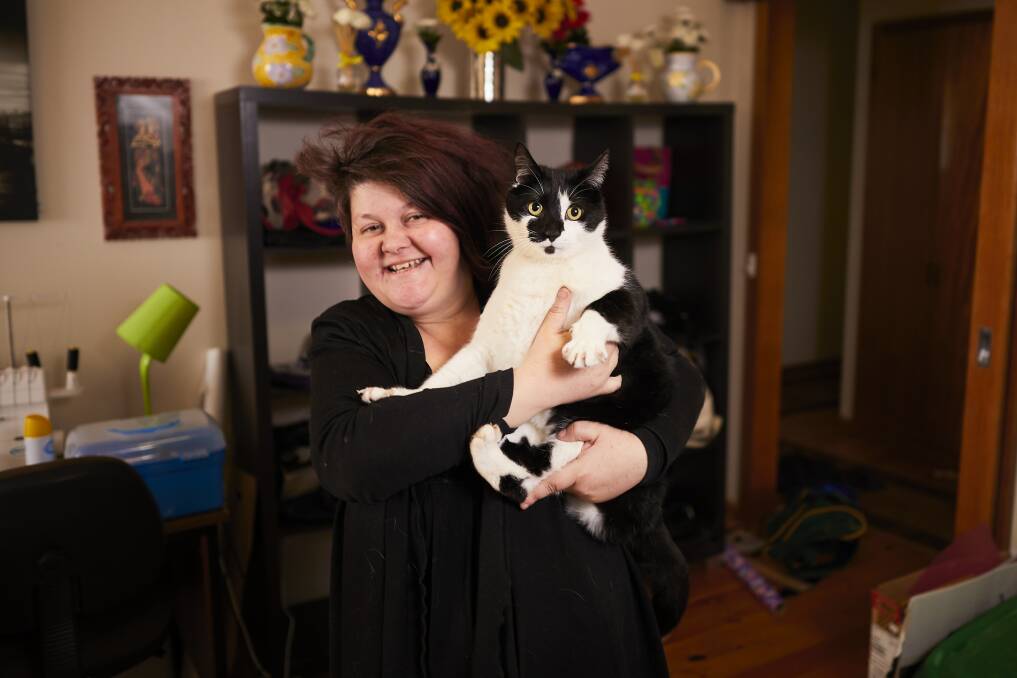 All smiles: After more than three years away from home, cat Moxy has finally been returned to Cindy McDonald. Picture: Luka Kauzlaric 