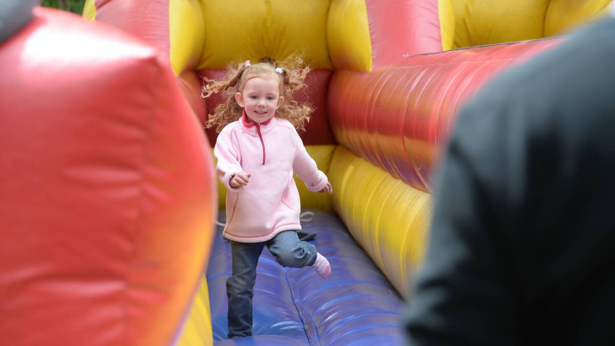 Three year-old Emily Hanrahan from Bungaree makes the most of Springfest at Lake Wendouree on Sunday.  Picture: Kate Healy.  