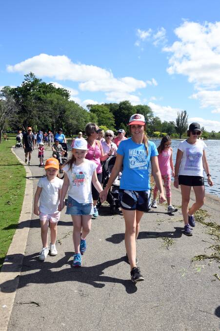 Walking in solidarity: Maizie Parker, 5, Acacia Borbach, 9, and Annie Harpur were among the crowd which marched around Lake Wendouree for  Juvenile Diabetes Research Foundation Australia’s One Walk. Picture: Kate Healy