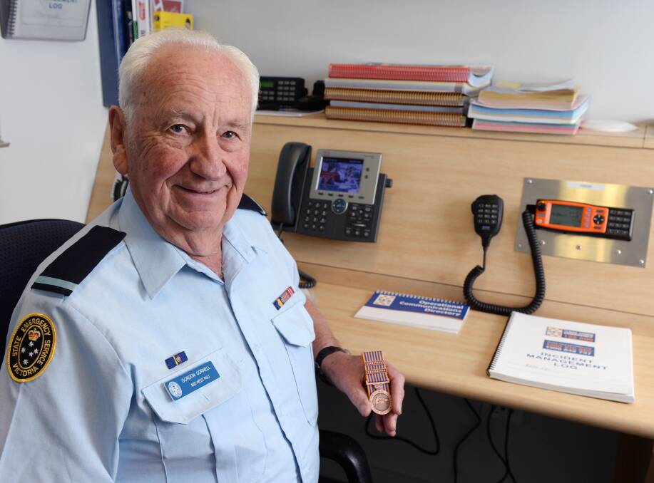 Radio specialist: Gordon Cornell displays his National Medal with bars for 35 years of service to the Ballarat community. Picture: Kate Healy.