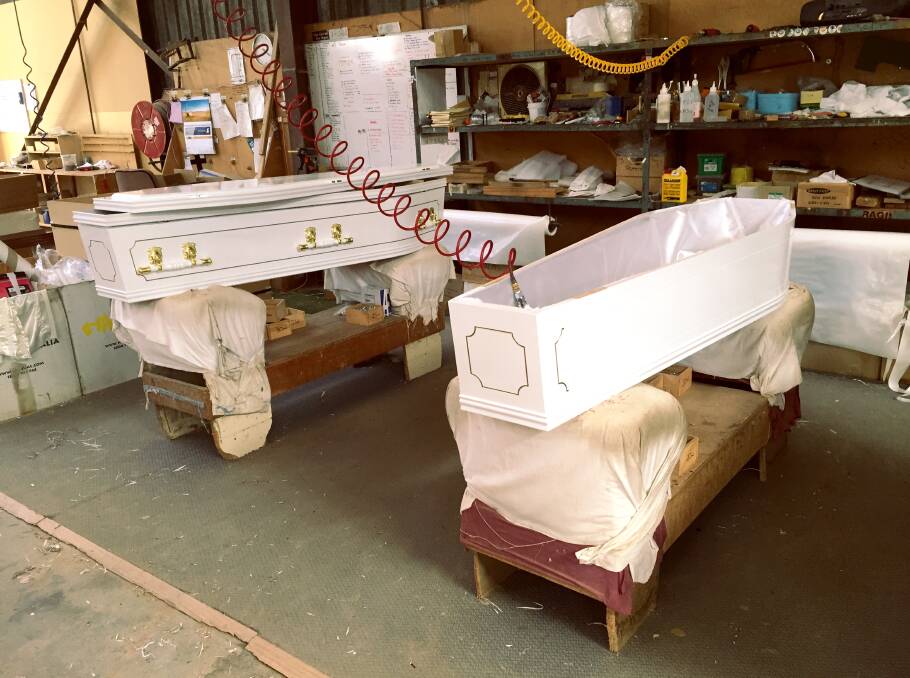 Coffins being lined and detailed for a job in Melbourne. Photo: Caleb Cluff.