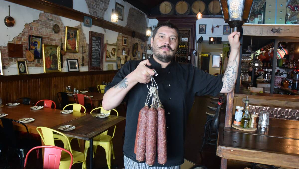DELICIOSO: Meigas owner and chef José Fernandez shows off some authentic Spanish produce.