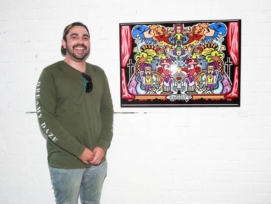 The Journey: Josh Muir stands alongside one of his works at a recent exhibition. Picture: supplied.