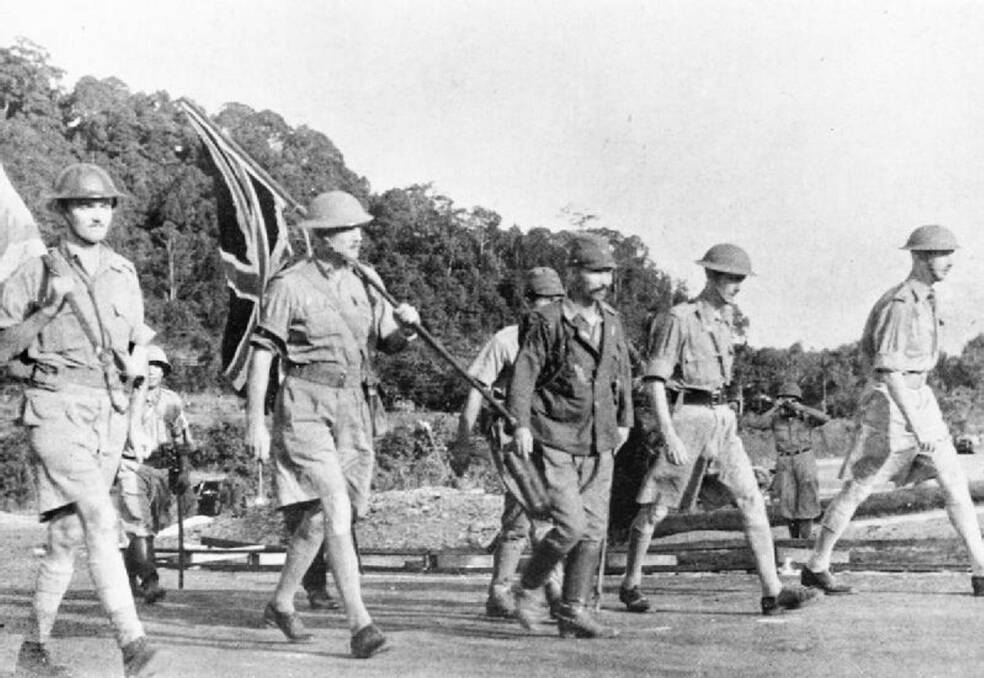 British Lieutenant-General Arthur Ernest Percival and a Japanese officer march out to negotiate the surrender of the Allied forces on Singapore,15 February 1942 - the largest surrender of British-led forces in history.