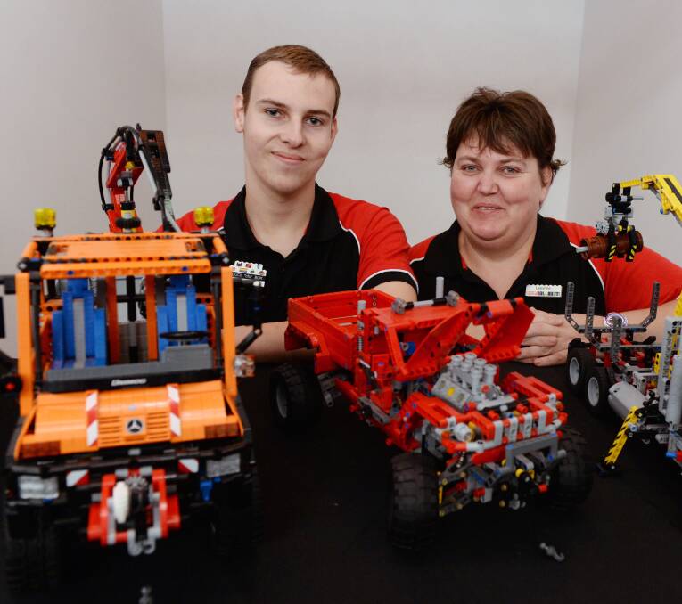 A channel to the world: Lachlan and Leanne Lucas with some of his working models. Photo: Kate Healy.