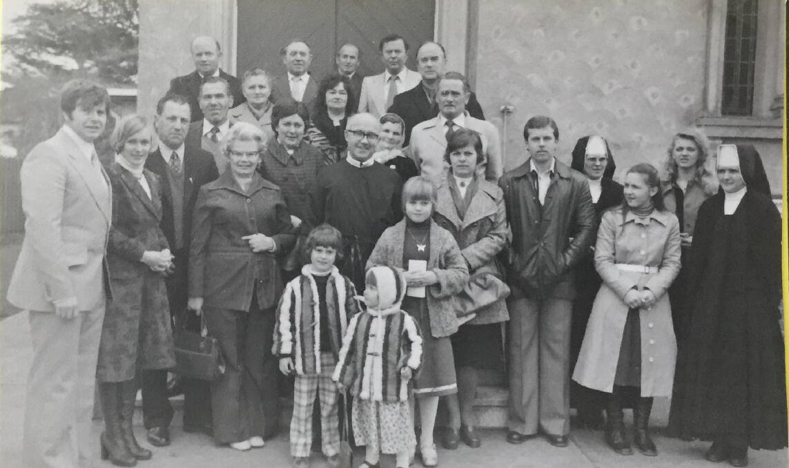Father Bowden ministering to Ukrainian Catholics at St Therese of the Little Flower in 1977.