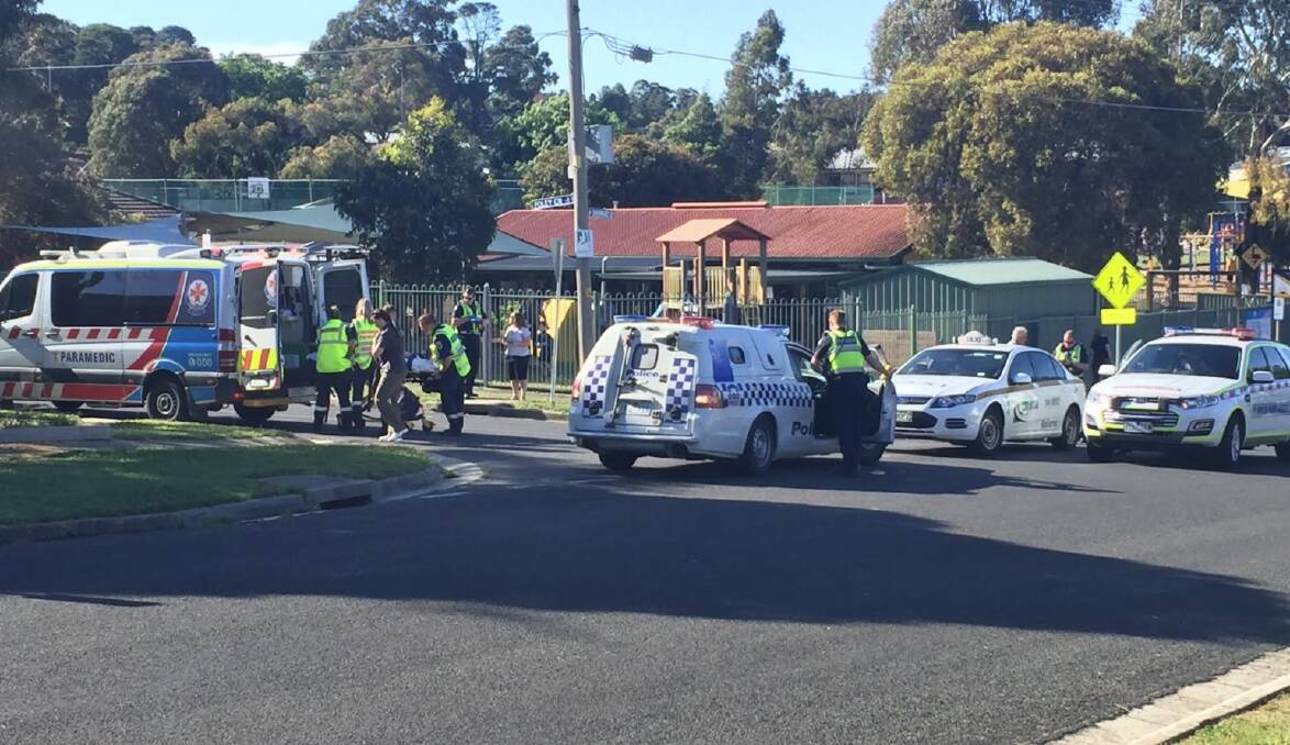 No serious injury: police and paramedics attend the scene of a collision between a cyclist and a taxi in Sherrard Street this morning. Picture: Caleb Cluff.
