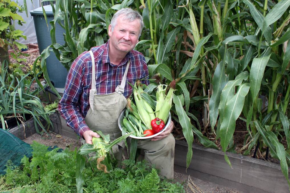 LEFT - a green thumb as well as an inky fingers: Gardening is one of John Ditchburn's three passions, and he's a well known speaker on growing food. 