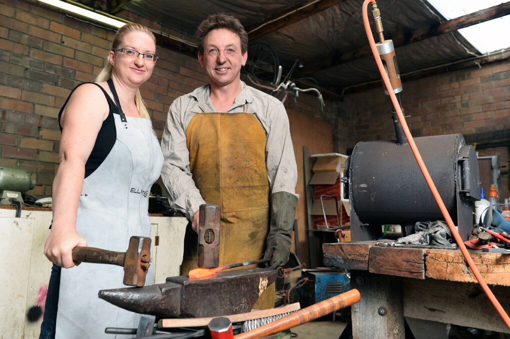 Knifemakers Terri and Adam Parker in their workshop in Ballarat. Photo: Kate Healy.