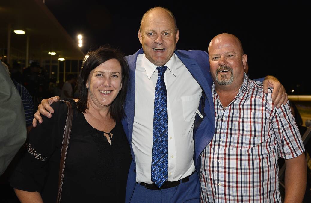 Sharon Hall and Shaun Hodgson enjoy the company of Billy Brownless at the 2017 Ballarat Pacing Cup. Picture: Dylan Burns.