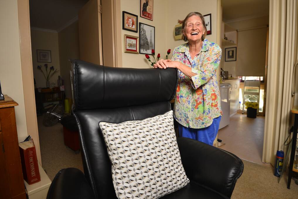 Generous donation: Dorian Macdonald with the new leather chair she would like to donate to the Huntlys. Dorian overcame a childhood of abuse and hardship to thrive as a writer and linguist and lover of opera. Picture: Dylan Burns.