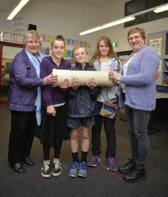 HANDOVER: At the Canadian Lead Primary School reunion and time capsule handover, Marjorie Sternman, Talia Peart, 10, Joe Maguire, 9, Latoya Gadd, 11, and Gwenda Skewes. Photo: Dylan Burns